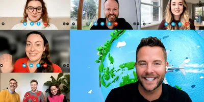 A video call grid of six windows, with smiling participants at home in the smaller tiles and a host in a black T-shirt in the large tile, in front of an illustrated globe with a plane flying past.