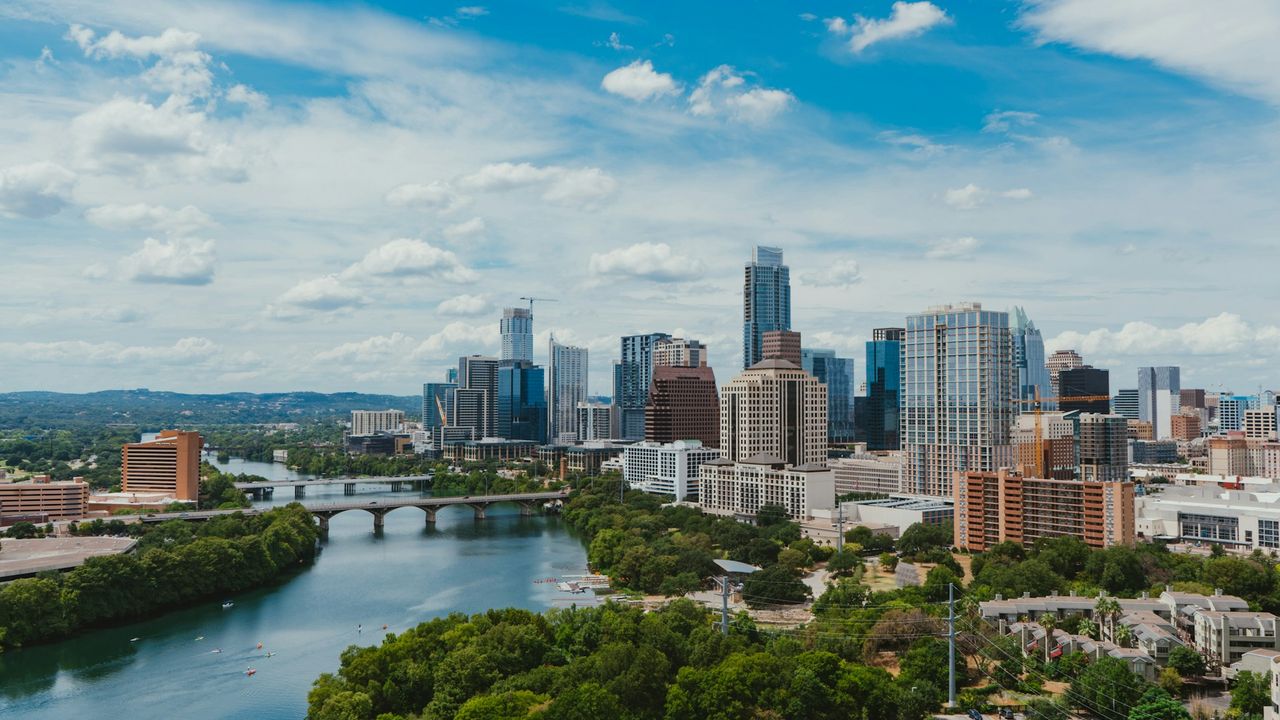 Austin skyline and riverfront under a blue sky