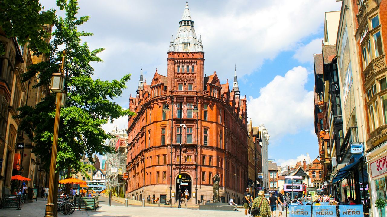 Nottingham city street with ornate red brick building