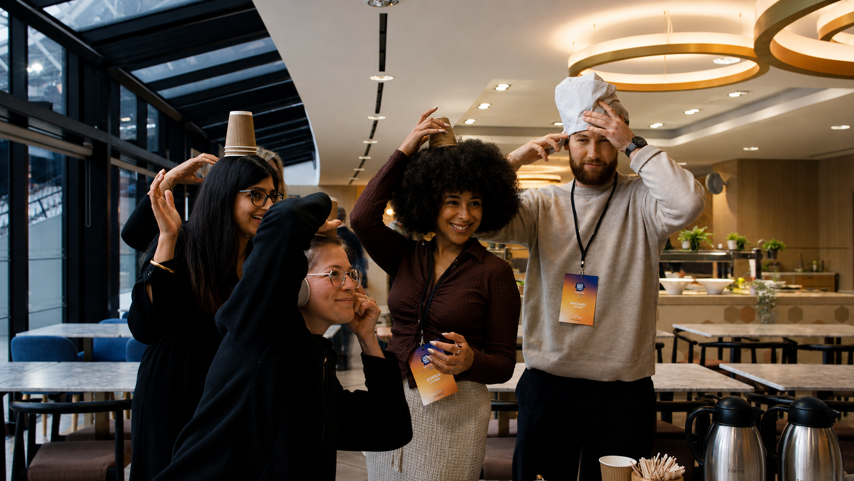 Colleagues at a corporate event taking a selfie together during an indoor team building activity.